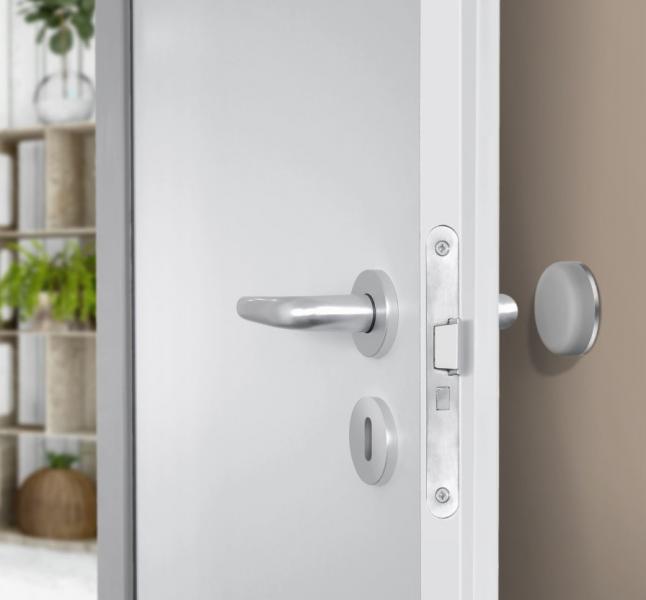 Beslagsboden selvkl&aelig;bende d&oslash;rstopper til v&aelig;g - Sort